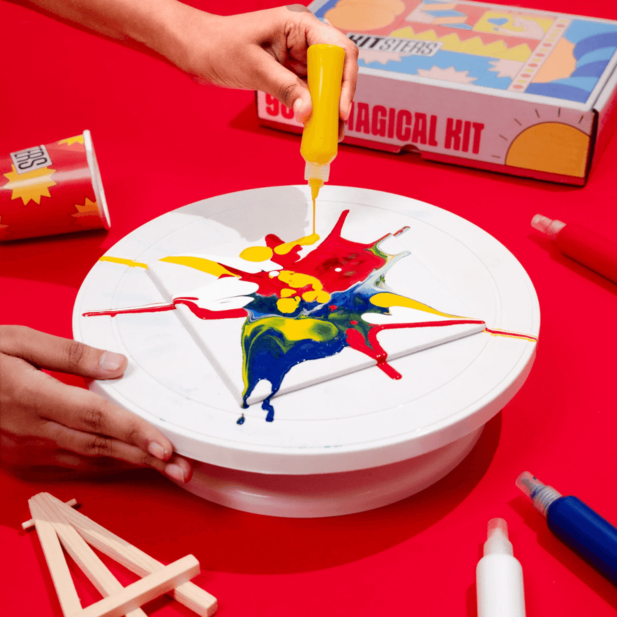 Paint being squeezed onto a spinning disc at a Kitsters spin-art station