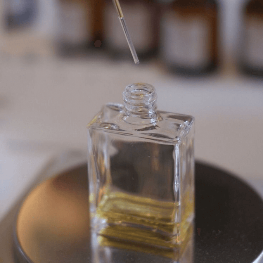 A perfume bottle being filled at a Kitsters blending bar
